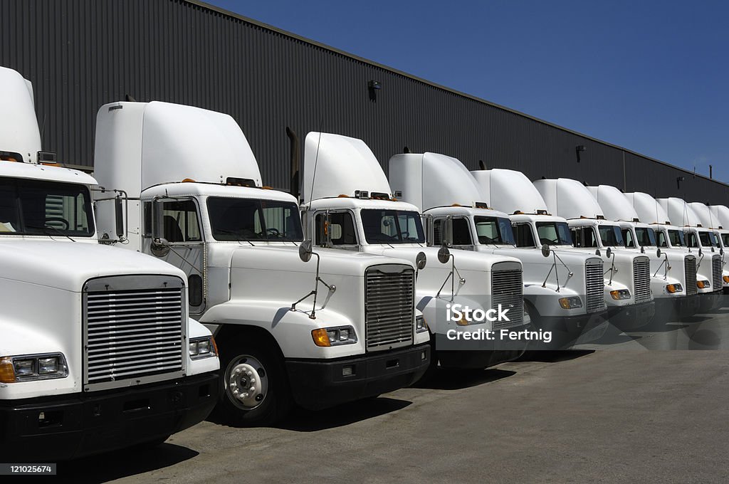 Tractor trailers in line  Fleet of Vehicles Stock Photo