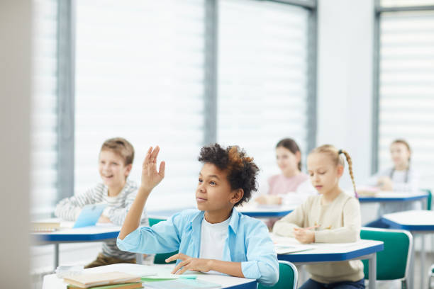 istock African-American Boy Raising Hand In Class 1210258484