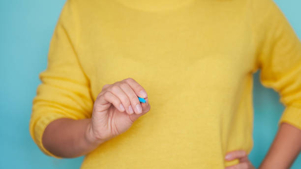 istock Young woman drawing on turquoise with white blue 1210259603