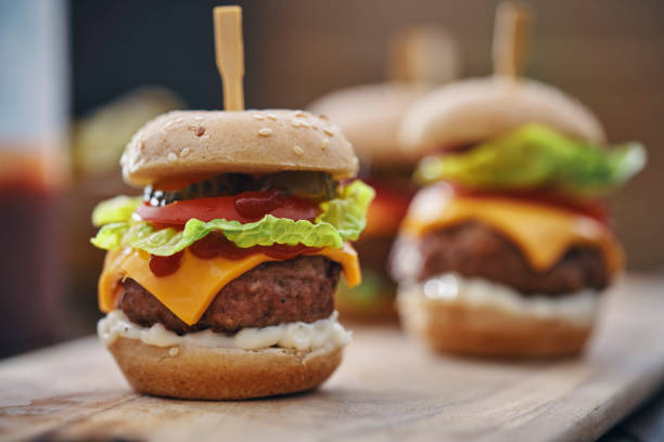 istock Mini Burgers with Tomato, Onion and Lettuce 1210259761