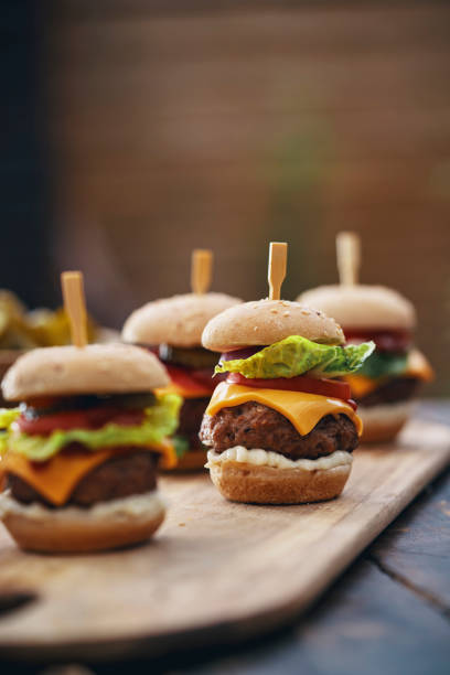 istock Mini Burgers with Tomato, Onion and Lettuce 1210259772