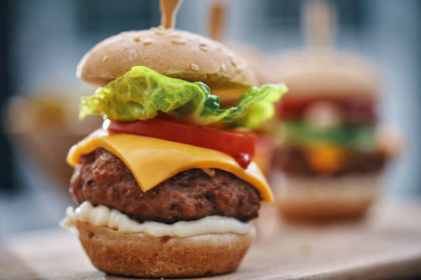 istock Mini Burgers with Tomato, Onion and Lettuce 1210259792