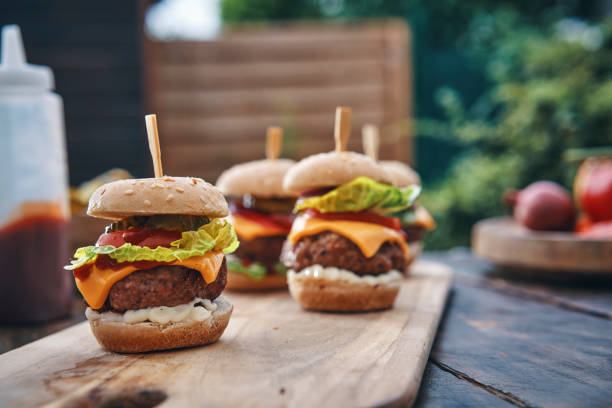 istock Mini Burgers with Tomato, Onion and Lettuce 1210260349