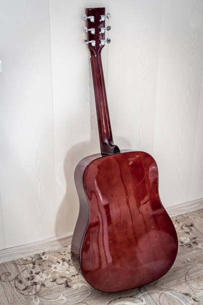 istock Guitar against the wall 1210260709