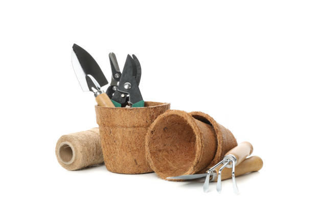 istock Flower pots and gardening tools isolated on white background 1210265511