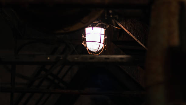 istock An old electric lamp dimly illuminates the communication tunnel. 1210265566