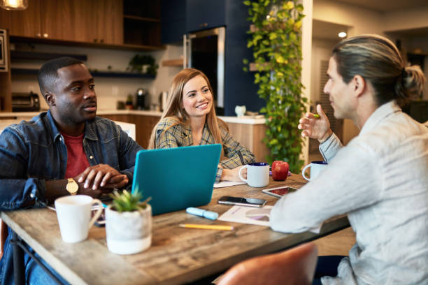 istock Business Team Discussing Project Plans in Coworking Office 1210265594