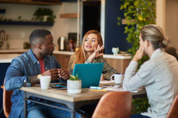 istock Businesswoman Explaining Idea in Coworking Office Space 1210265603