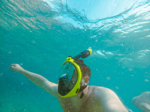 istock man with snorkeling mask underwater summer sea vacation 1210266693