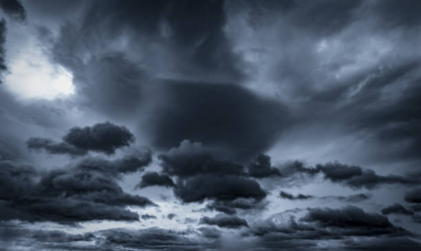istock Dark dramatic sky and clouds. Background for death and sad concept. Gray sky and fluffy white clouds. Thunder and storm sky. Sad and moody sky. Nature background. Dead abstract background. Cloudscape. 1210267881