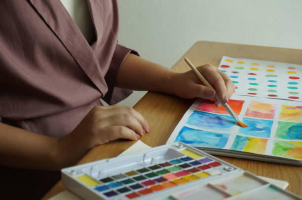 istock Watercolor paints and brushes workplace artist with artistic tools for mock up.Creative Design Concept. 1210267983