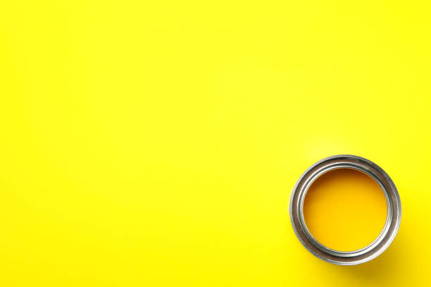 istock Paint can on yellow background, top view 1210269792