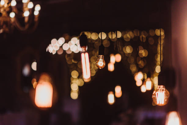 istock Hanging Bulbs variety and string lights bokeh 1210271199