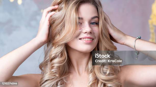 Beautiful Young Woman With Perfect Blonde Tone Beautiful And Wellgroomed Curls Stock Photo - Download Image Now