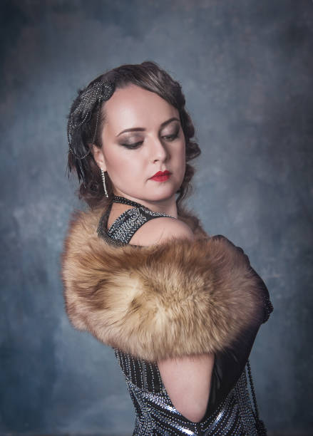 istock Beautiful elegant woman in retro 20 – 30 style on blue background 1210274329