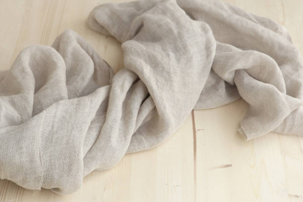 istock Pure Washed Linen cloth on wooden panel. 1210275893