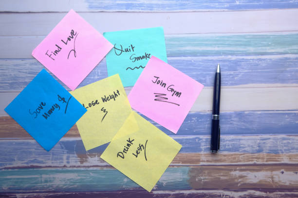 istock top view new year goals written on sticky notes on table 1210277969