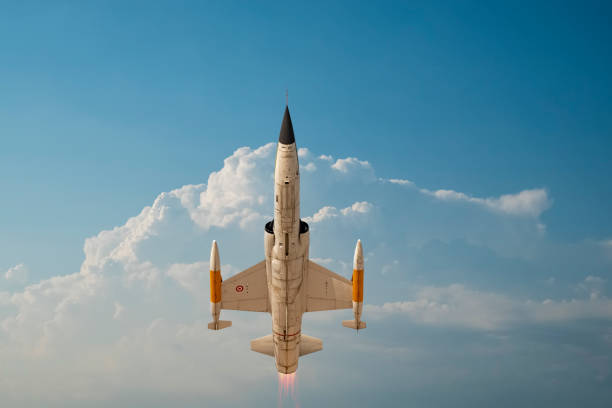 istock a jet plane flying among the clouds 1210278204