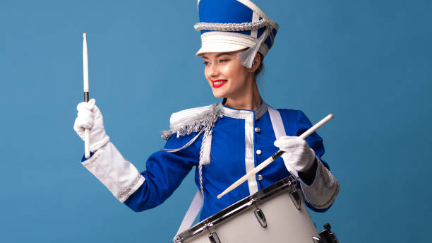istock drummer in a blue uniform drums on a drum, show program and celebration. 1210278405