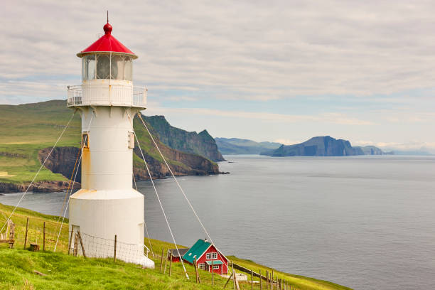 istock Mykines lighthouse and cliffs on Faroe islands. Hiking landmark 1210279591