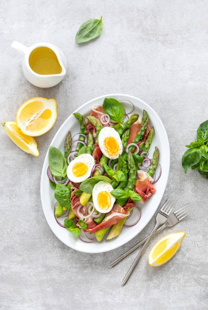 istock Spring protein rich asparagus salad, top down view 1210283963