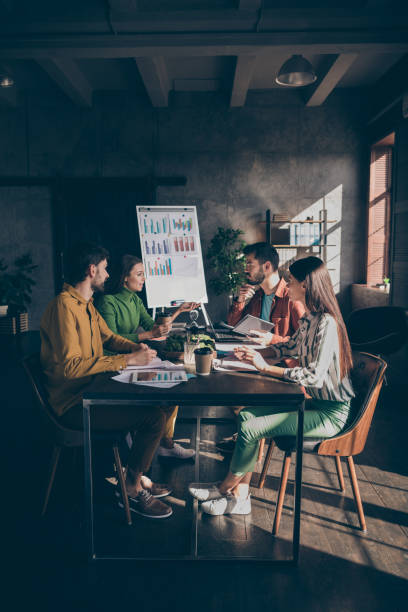 istock Experience group student people gather big dark office workstation sit desk table partners ceo marketer analyze start up development aims tell innovation money capital project 1210284042
