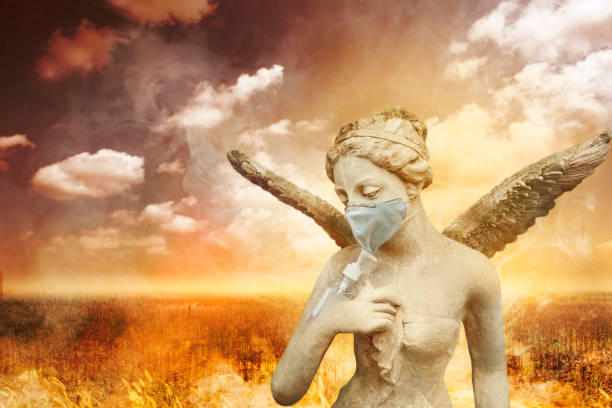 angel statue using washing hand with alcohol sanitizer and dust mask on arid meadow background. to protect themselves from virus infection in  corona virus crisis - people cemetery church urban scene imagens e fotografias de stock