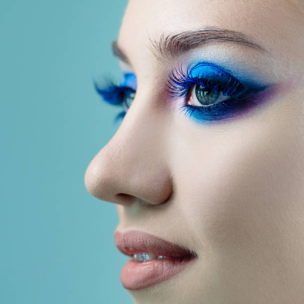 istock Glamorous bright eye makeup using the trend color classic blue, women's eyes close-up. 1210285901