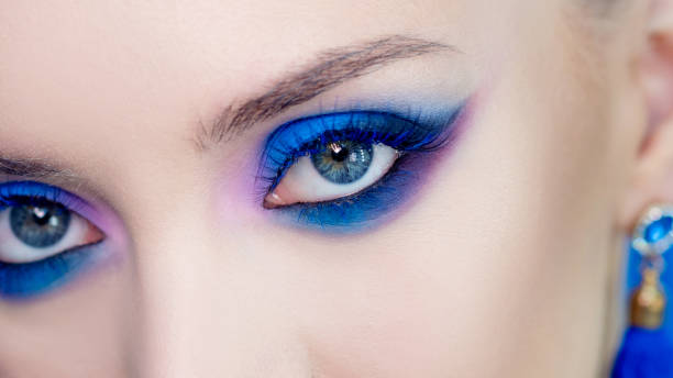 istock Glamorous bright eye makeup using the trend color classic blue, women's eyes close-up. 1210285914