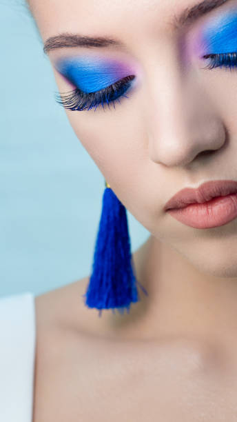 istock Glamorous bright eye makeup using the trend color classic blue, women's eyes close-up. 1210285973