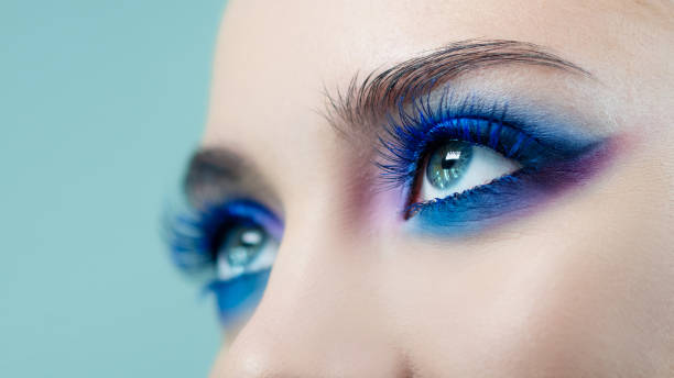 istock Glamorous bright eye makeup using the trend color classic blue, women's eyes close-up. 1210285993
