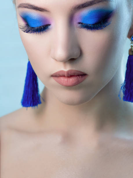 istock Glamorous bright eye makeup using the trend color classic blue, women's eyes close-up. 1210286050