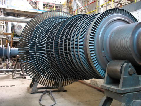 Power generator steam turbine during repair, machinery, pipes, tubes at a power plant