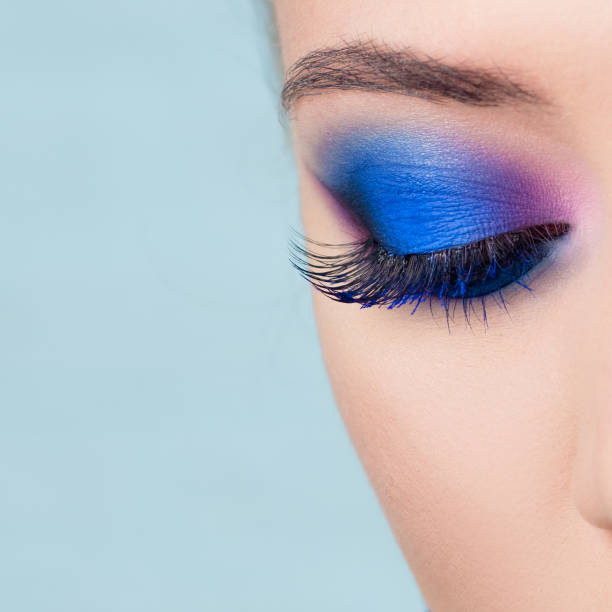 istock Glamorous bright eye makeup using the trend color classic blue, women's eyes close-up. 1210286274