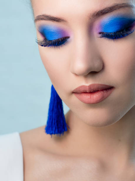 istock Glamorous bright eye makeup using the trend color classic blue, women's eyes close-up. 1210286281