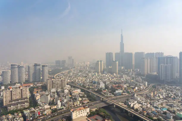 Photo of Industrial city background with sky hazed with smog