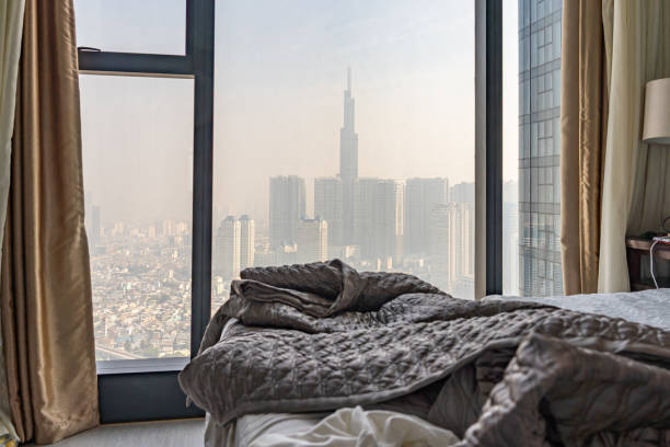 istock Skyscrapers and polluted city view from bedroom's window 1210287733