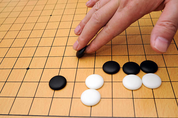 Playing go game stock photo