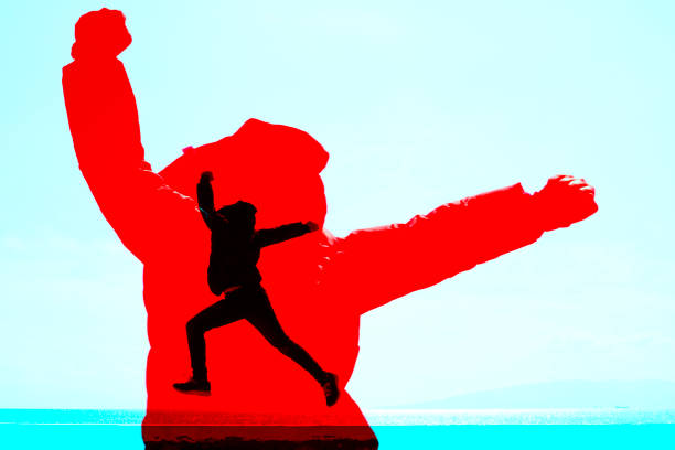 Teenage boy jumping on the pier