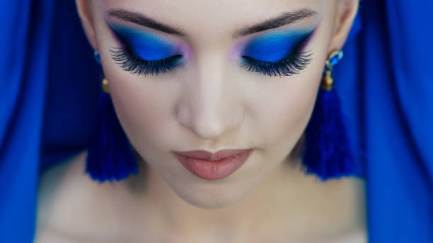 istock Glamorous bright eye makeup using the trend color classic blue, women's eyes close-up. 1210288300