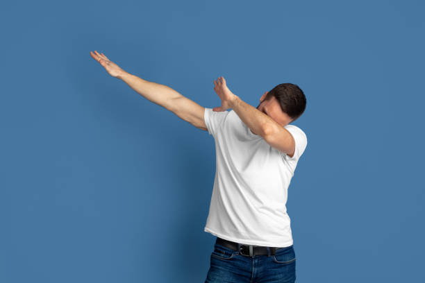 istock Caucasian young man's portrait on blue studio background 1210289867