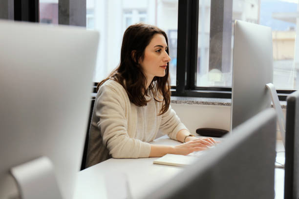 istock Young woman works in the office 1210289915