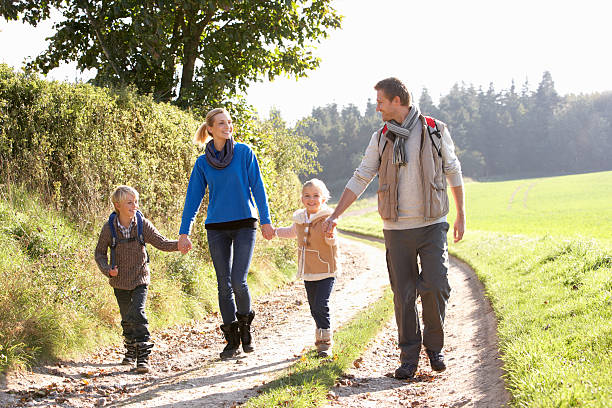 istock Young family walking in park 121029001