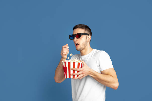istock Caucasian young man's portrait on blue studio background 1210290095