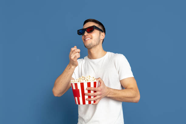 istock Caucasian young man's portrait on blue studio background 1210290097