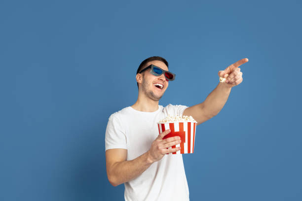 istock Caucasian young man's portrait on blue studio background 1210290102