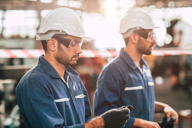 istock Head of engineer, worker leader portrait self confidence and professional look wearing safty glasses and white helmet. 1210290718