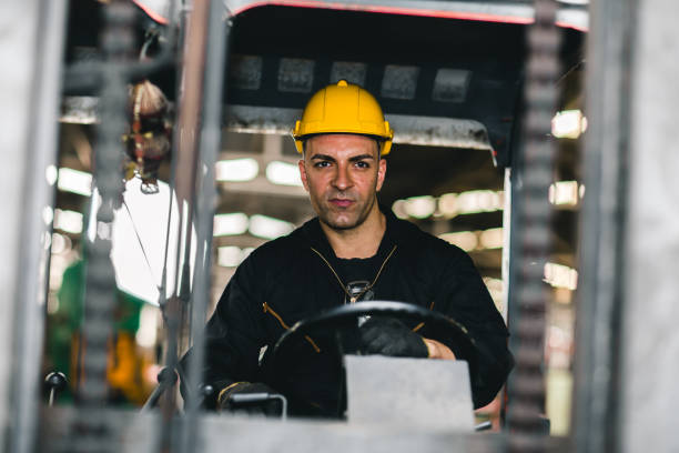 istock Caucasian factory worker forklift driver in cargo logistic shipping industry. 1210292880