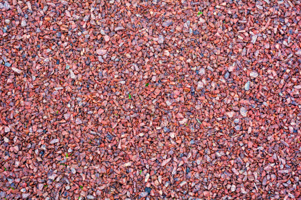 istock Red, white granite fine gravel, simple stone background, pebbles stone texture 1210292908