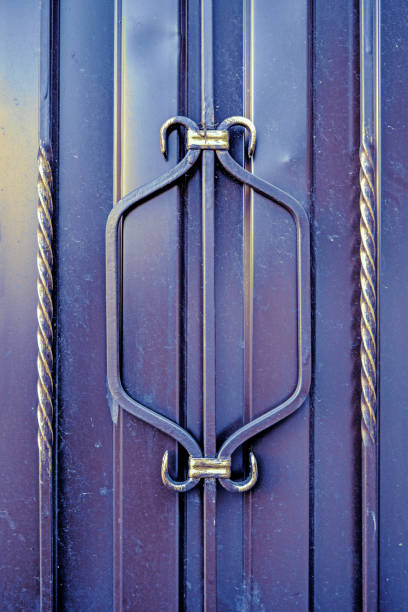 istock Architectural decorative exterior metal fence. Metal gates, forged pattern 1210293470